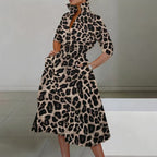 Elegant leopard print long-sleeve dress for women with pockets, featuring a cross V-neck and high collar, perfect for autumn and winter.
