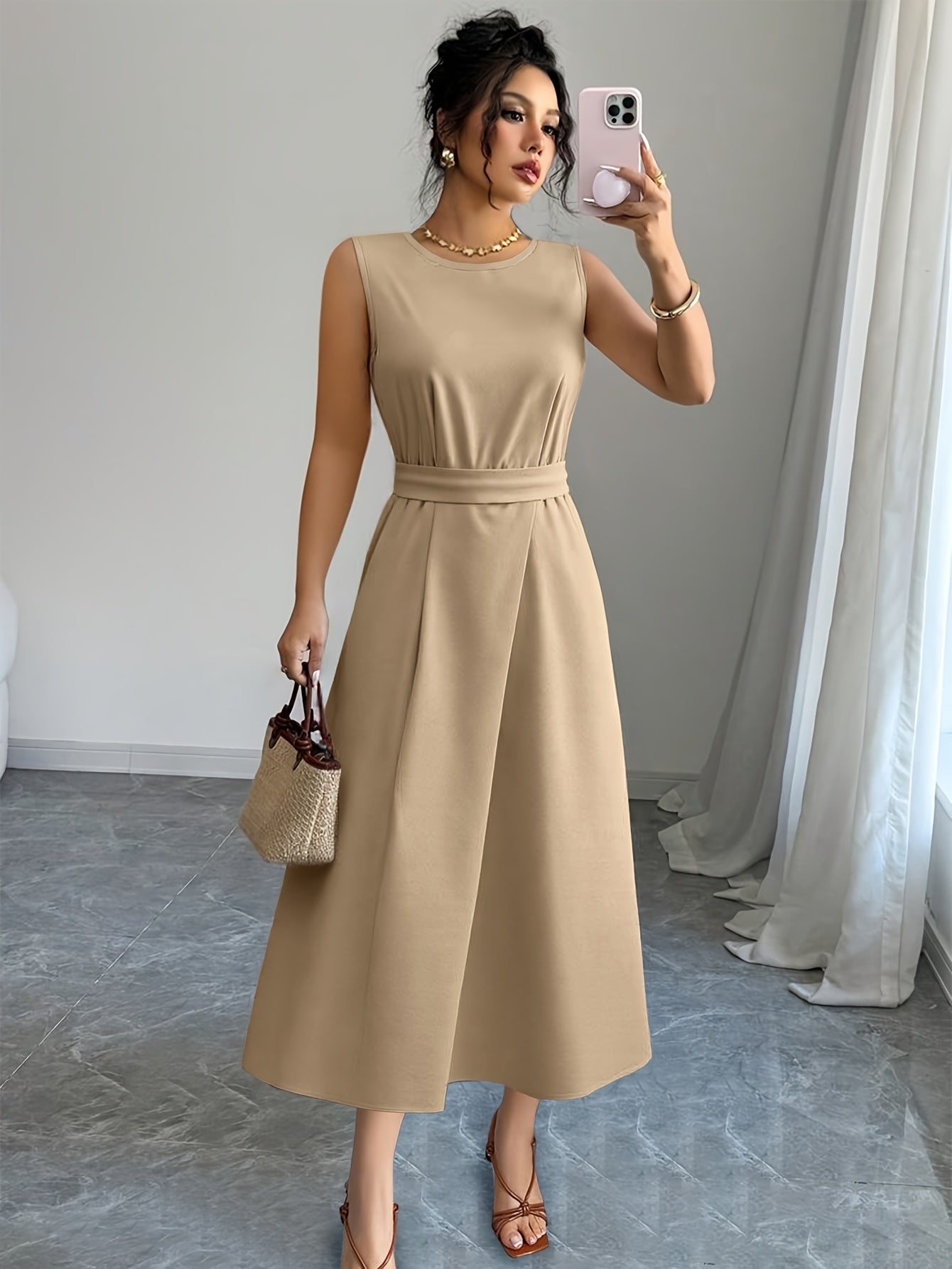 Summer ladies' fashionable, simple and solid color long dress with round neck and sleeveless waist design is suitable for daily commuting and vacation.