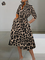 Elegant leopard print long-sleeve dress for women with pockets, featuring a cross V-neck and high collar, perfect for autumn and winter.